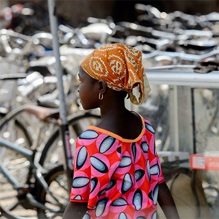 Young woman with beautiful coloured dress in Dakar, Senegal: Urban Yellow Fever is an ongoing risk in West Africa